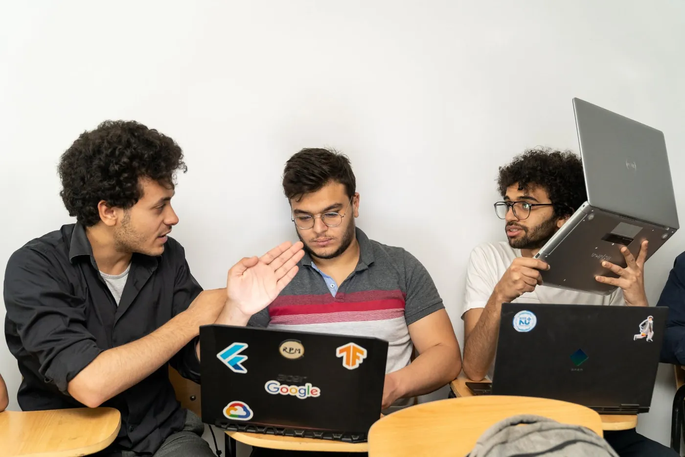 Participants working together on laptops