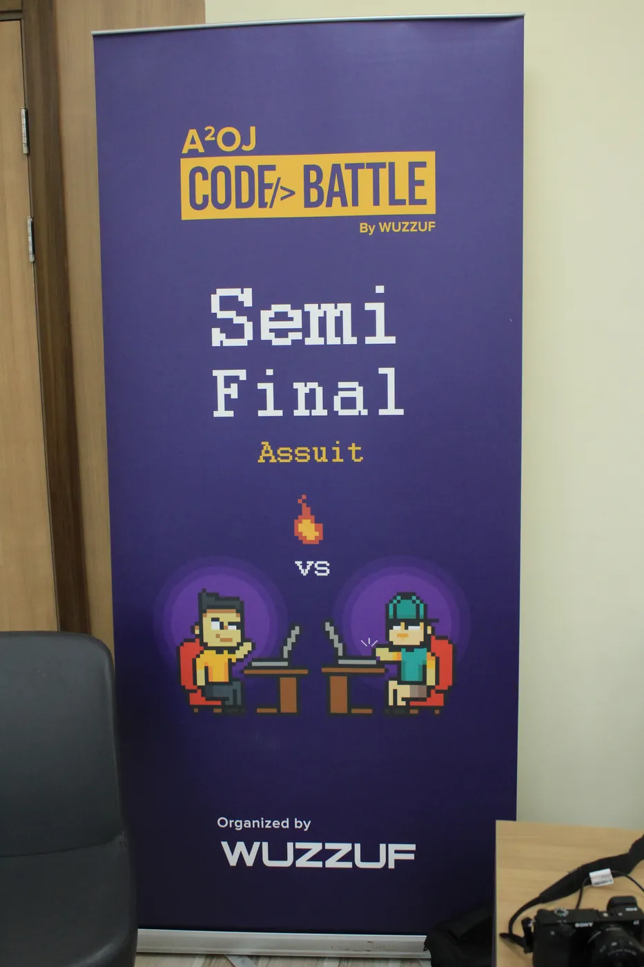 Code Battle semi-final banner, Assiut