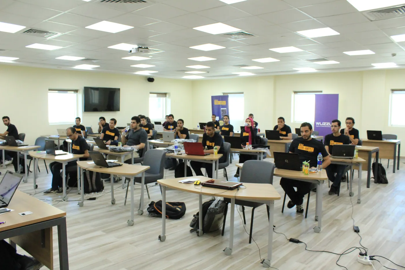 Contestants coding at the Assiut semi-final