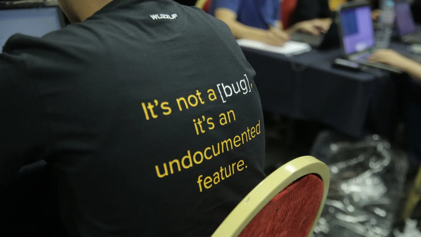 Code Battle t-shirt: It’s not a bug, it’s an undocumented feature